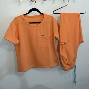 Figs Shaka orange scrub set. PO# 5754 and PO#5712